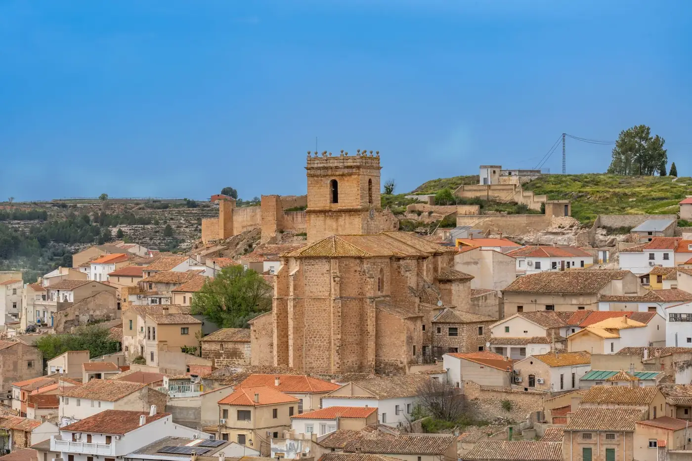A beautiful panoramic view of Jorquera village with historic architecture under a clear blue sky.