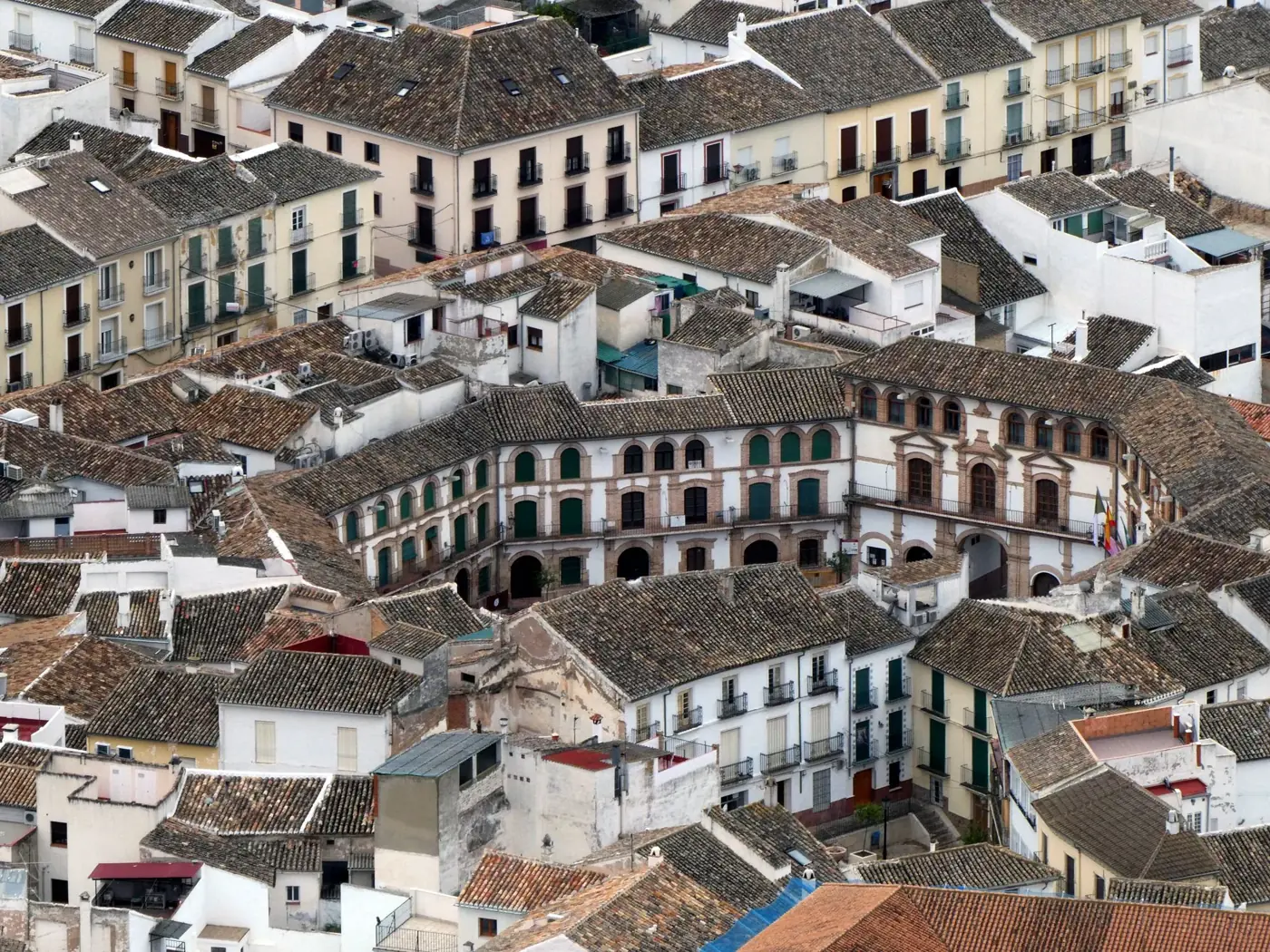 Aerial view of historic Plaza Ochavada surrounded by charming buildings in Archidona, Spain.