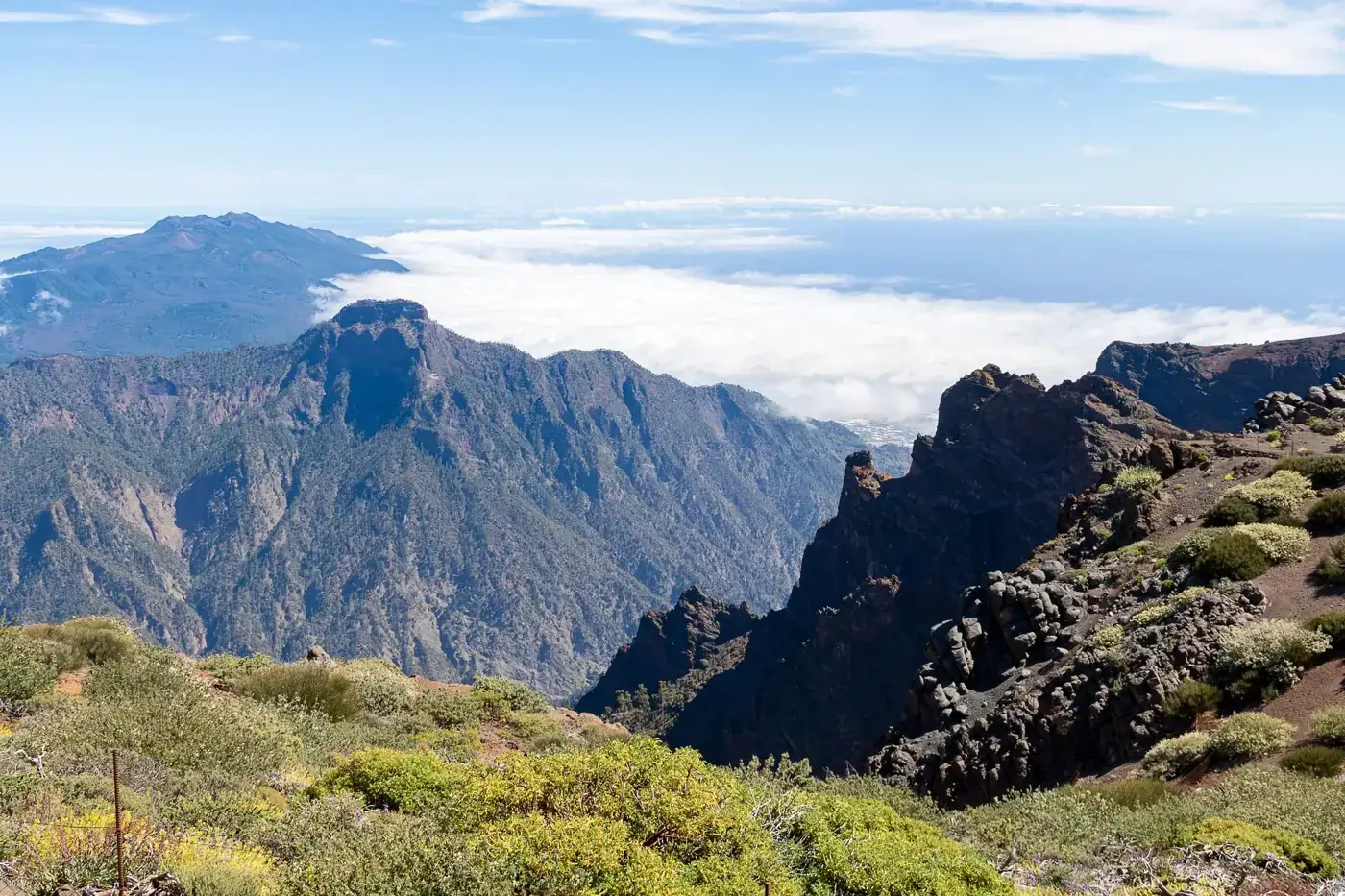 Dramatic view of rugged mountains and clouds in La Palma, Spain. Perfect for nature enthusiasts.