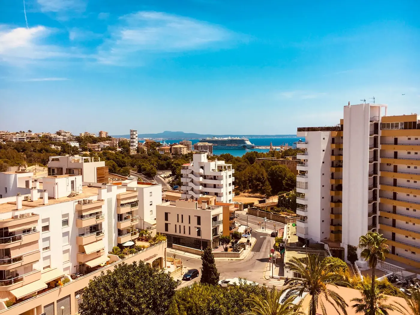 Featuring the beautiful coastal cityscape of Palma, Spain, under a clear blue sky.