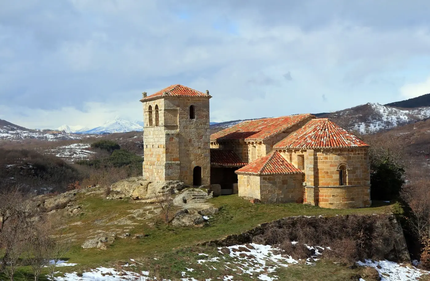 Church of Santa Leocadia nestled in the snowy mountains of Castrillo de Valdelomar, Spain.