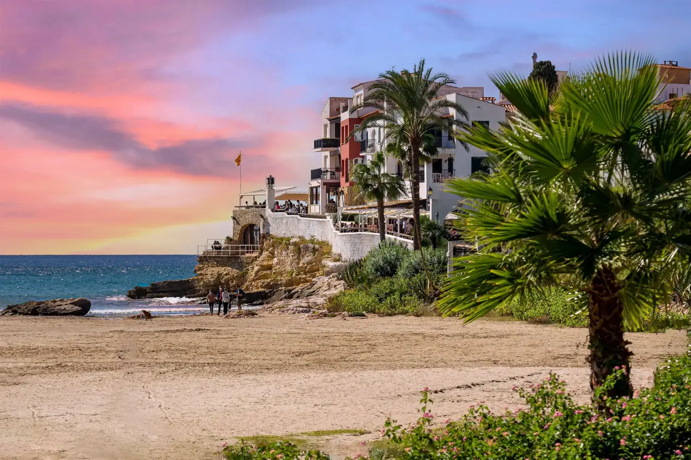 Stunning view of a Spanish coastal village with sunset hues in Roda de Berà.