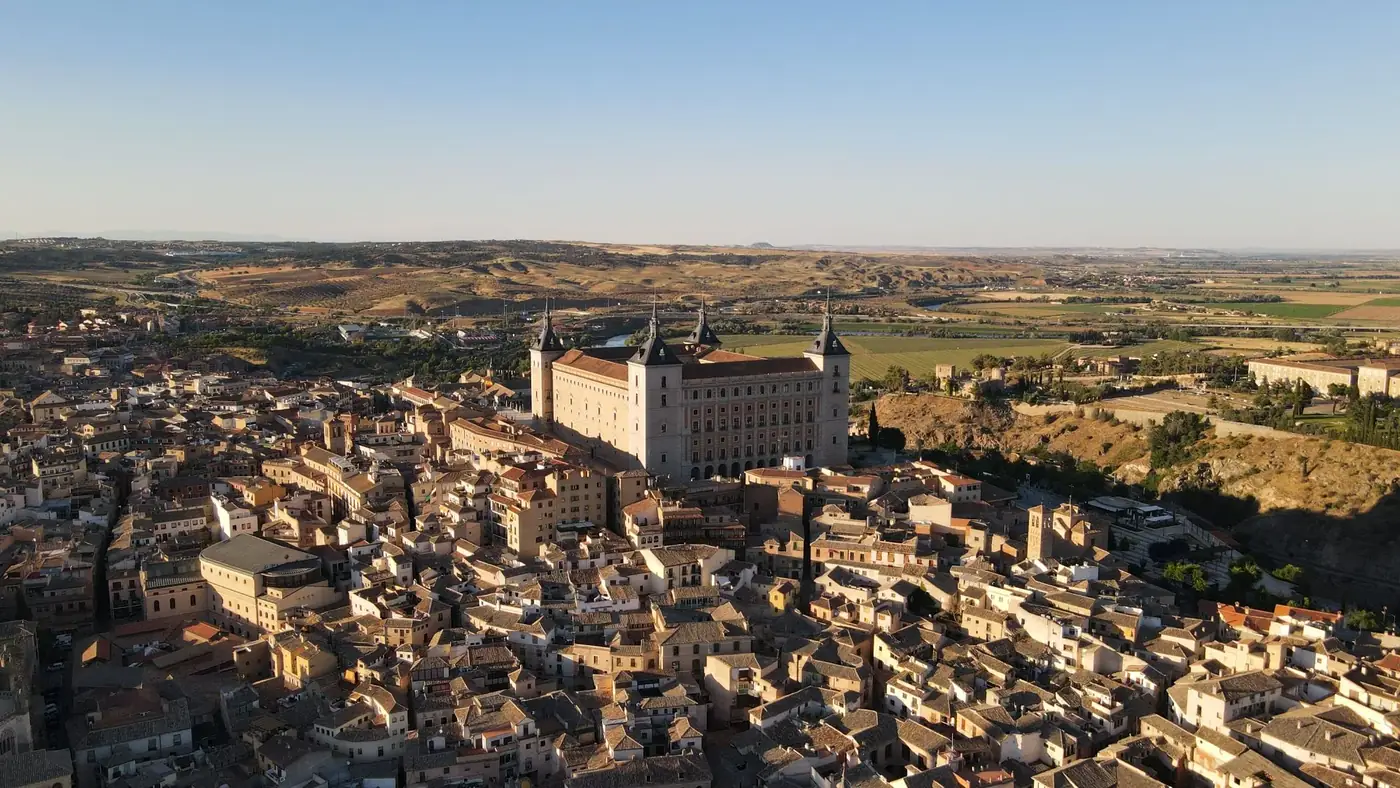 Breathtaking aerial shot of the historic Alcazar of Toledo in Spain during daytime.