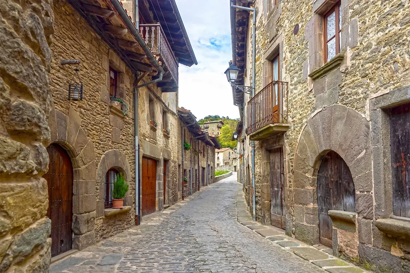 Experience the historic charm of Rupit's narrow cobblestone streets lined with rustic stone buildings.