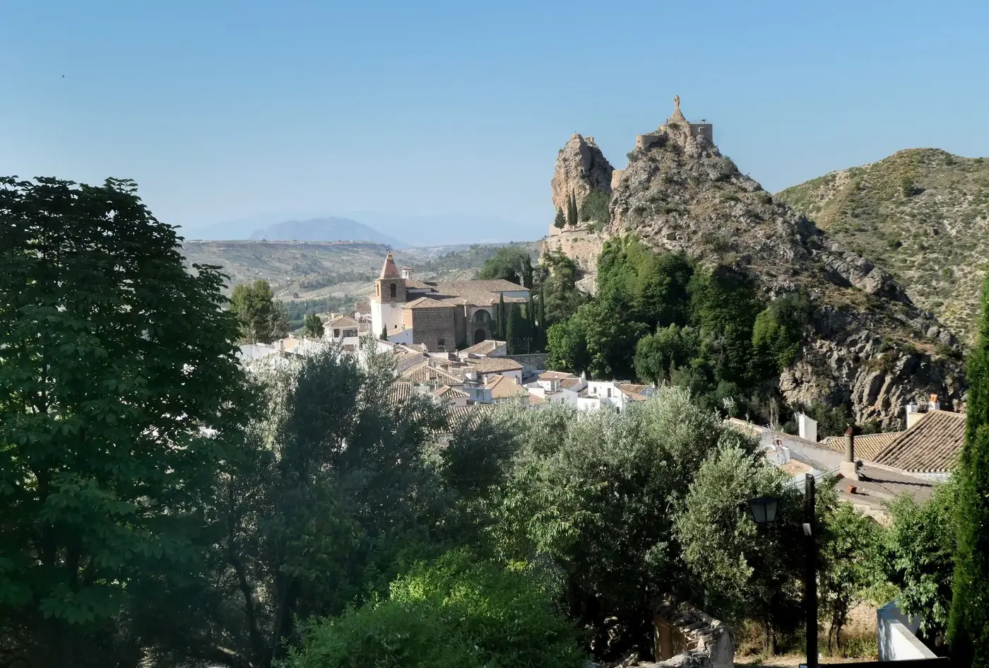 Explore the stunning landscapes and historic landmarks of Castril, Spain during summer.