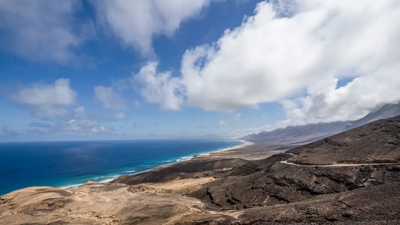 Stunning drone shot of the volcanic coast in Fuerteventura, showcasing dramatic landscapes.