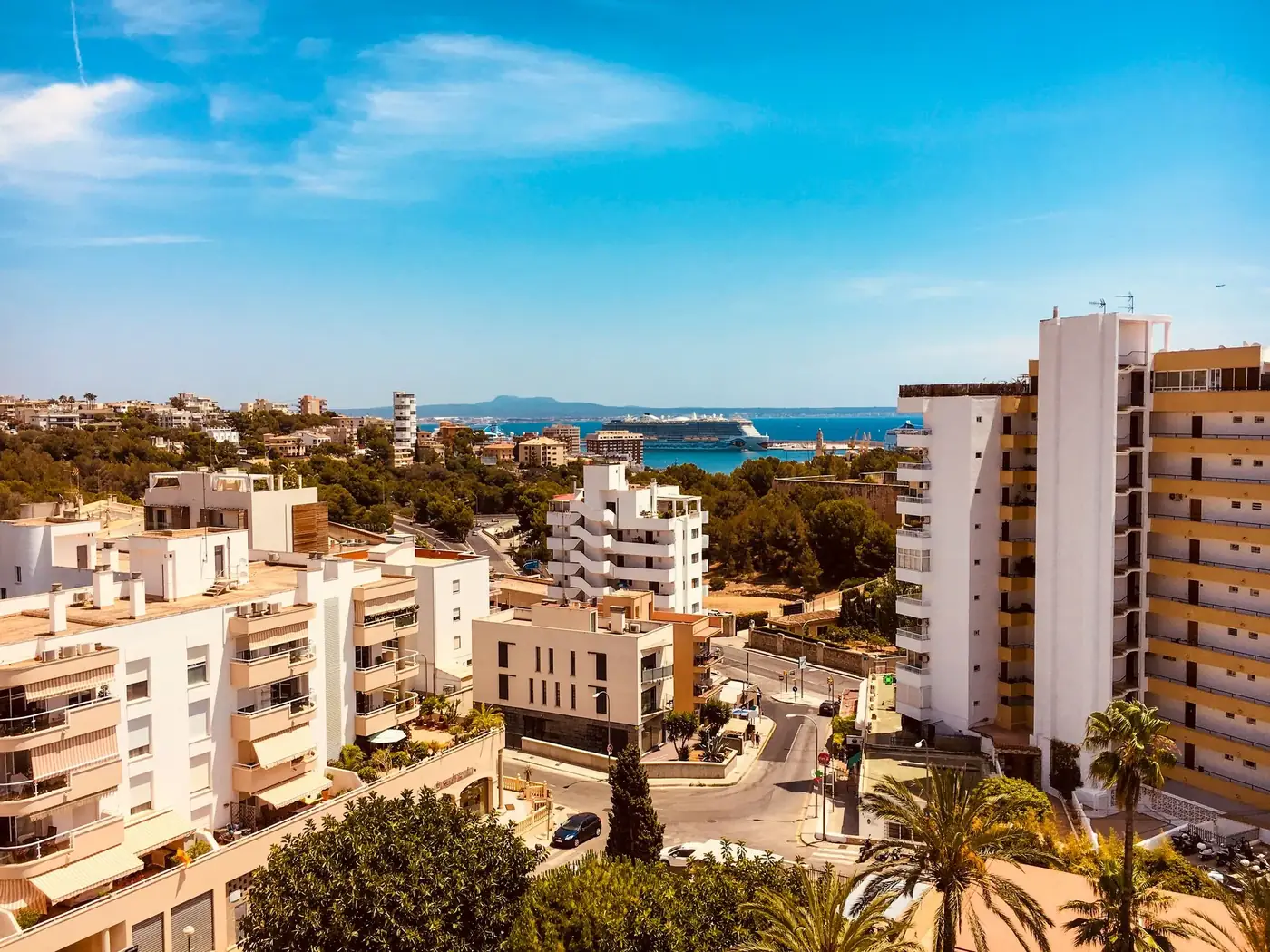 Featuring the beautiful coastal cityscape of Palma, Spain, under a clear blue sky.
