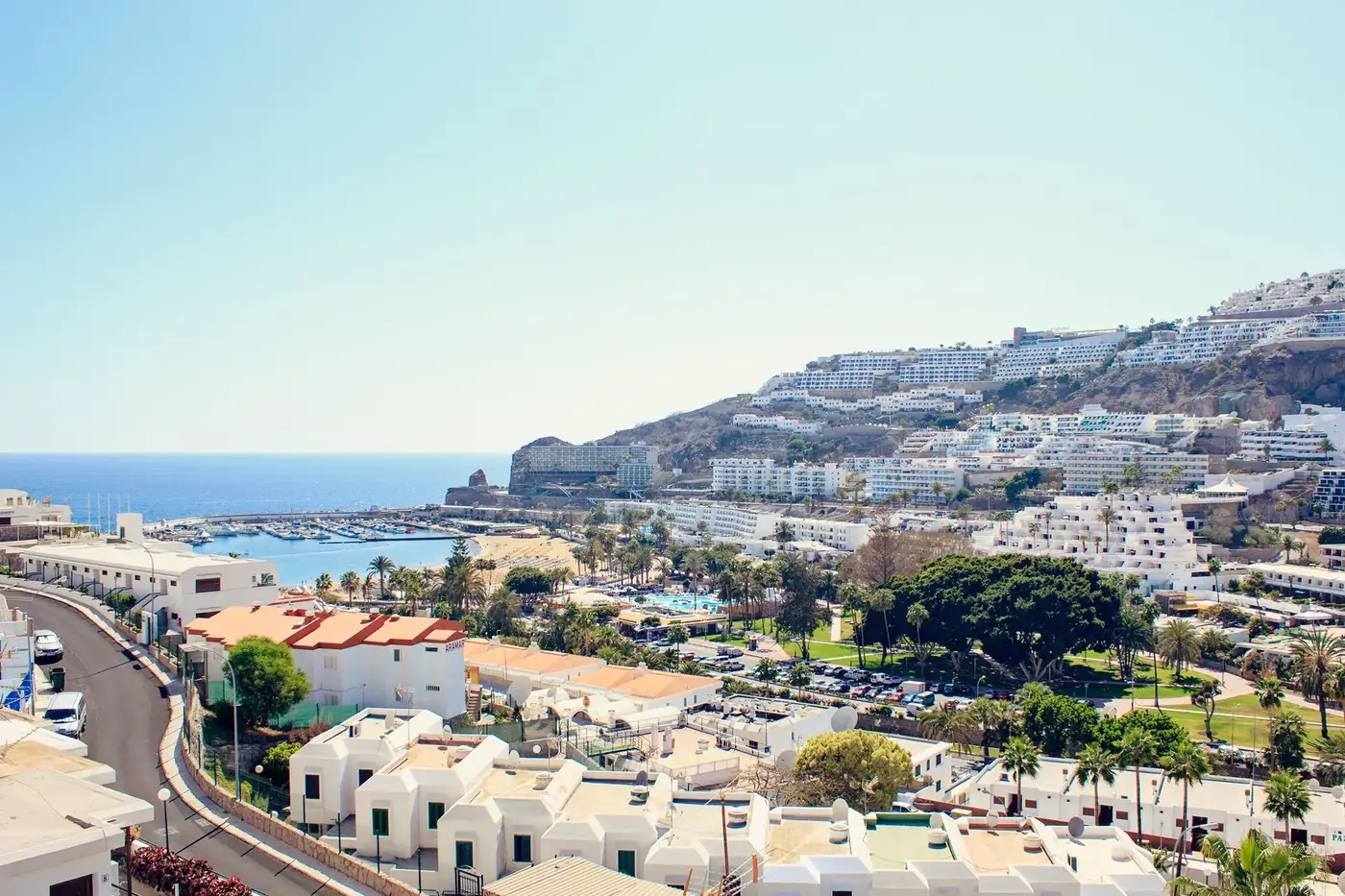 A picturesque Mediterranean townscape overlooking the ocean, showcasing a harmonious blend of city architecture and coas