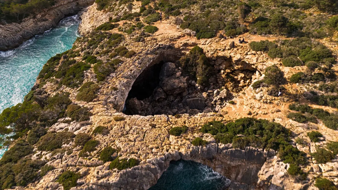Stunning aerial view of rocky cliffs and turquoise sea in Majorca, Balearic Islands, Spain.