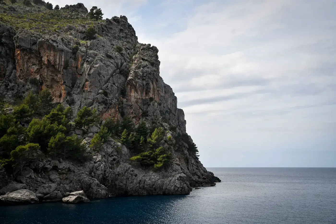 Majestic cliffs meet the Mediterranean in this scenic view of Mallorca, Spain.