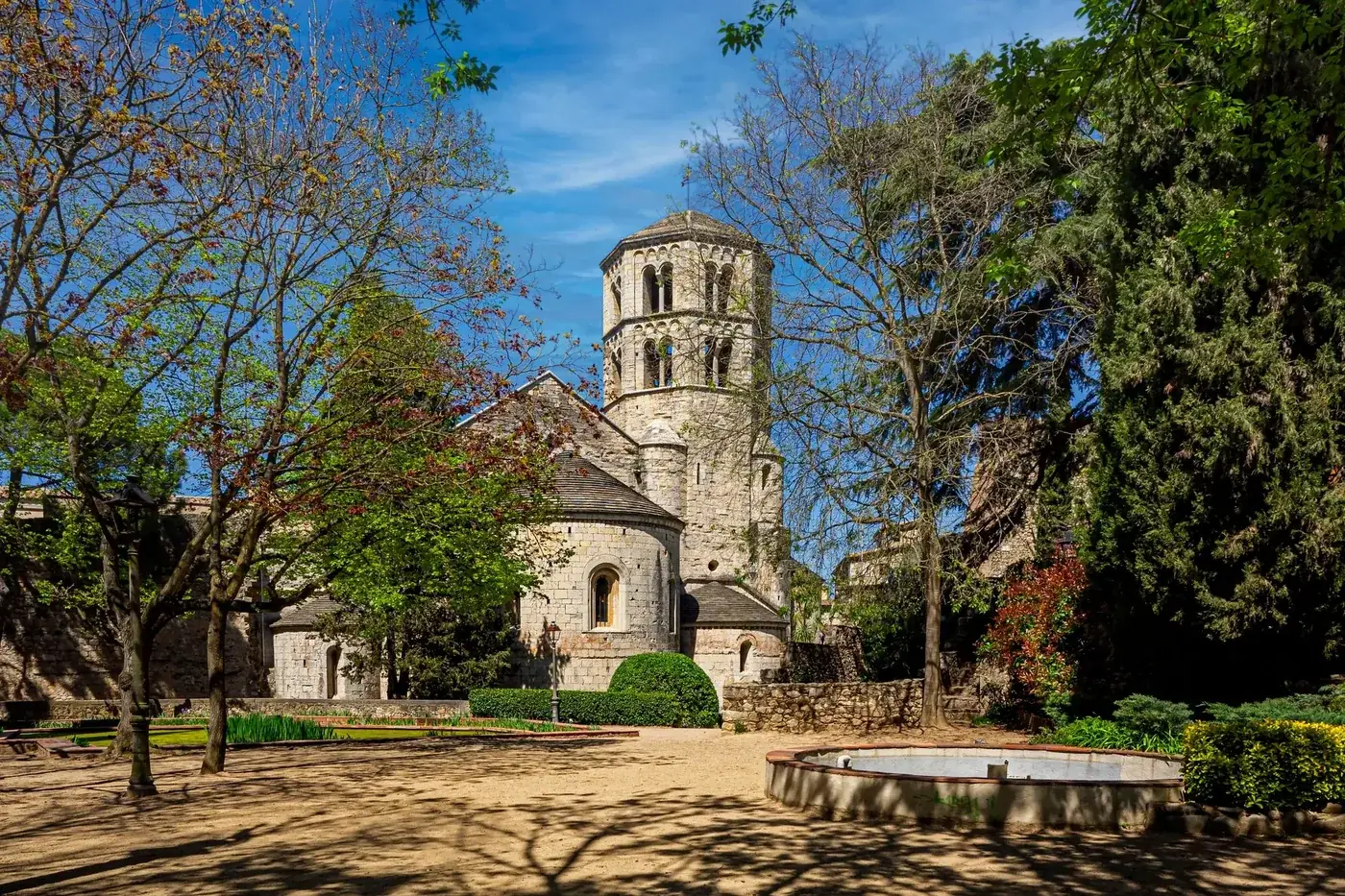Explore the serene garden view of Sant Pere de Galligants Abbey in Girona, Spain.