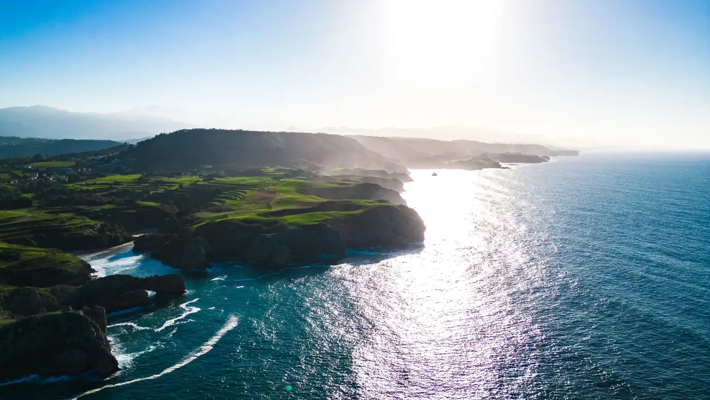 Breathtaking aerial view of the rugged Asturias coastline in Spain during daylight.