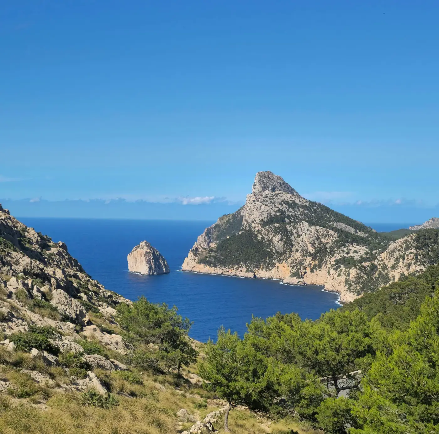 Beautiful island view with rocky cliffs and clear blue sea in IB, Spain.