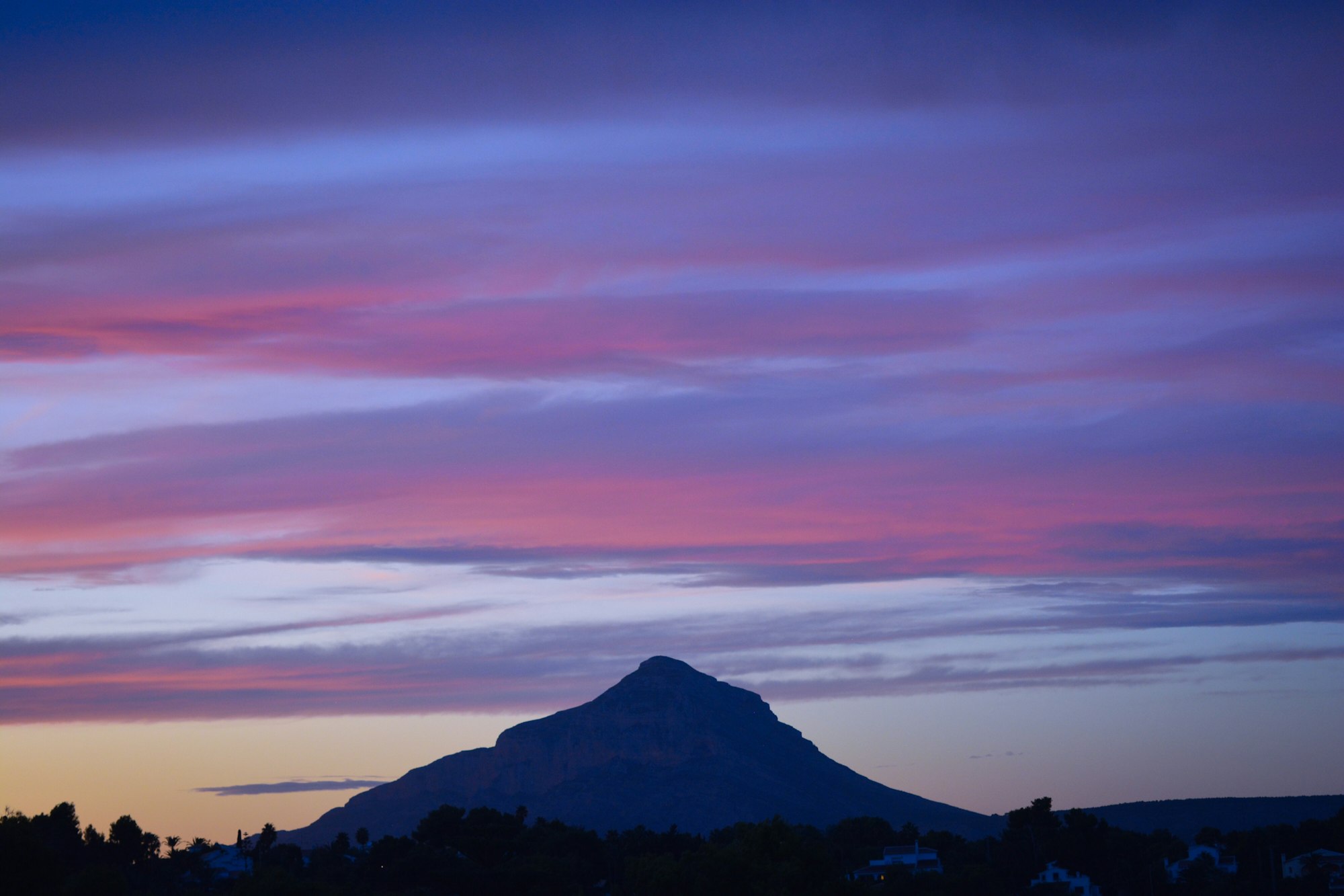 Sunset sky with Montgo Mountain in silhouette, Xabia / Javea, Alicante Province, Spain